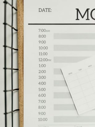 Top view of a minimalist schedule planner with Monday header. Perfect for organizing daily tasks with goals section.