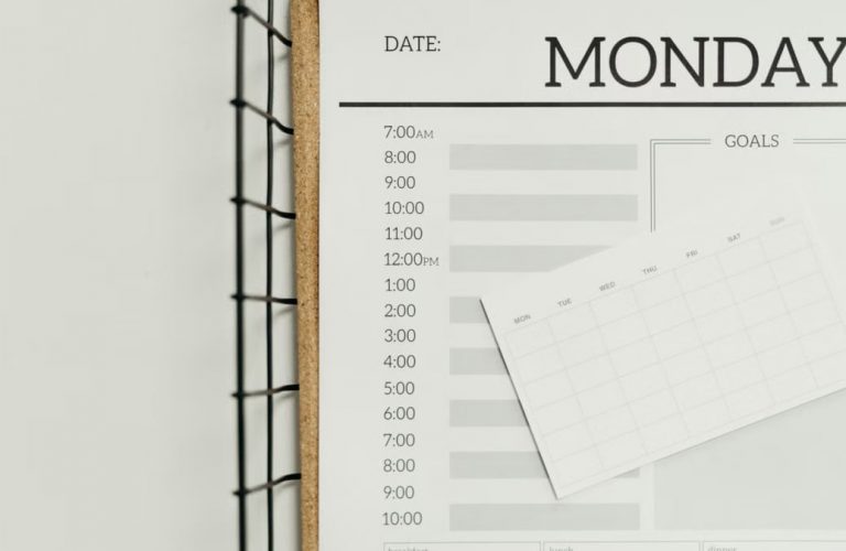 Top view of a minimalist schedule planner with Monday header. Perfect for organizing daily tasks with goals section.